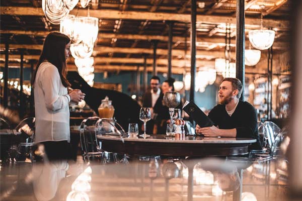 Waitress taking a customer’s order at table in a restaurant