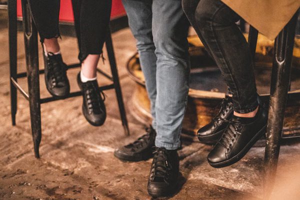 Waiter and waitresses wearing supportive Old School and Delray shoe styles in black