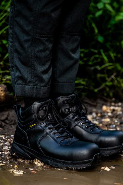 Military personnel wearing durable Shoes For Crews Guard style standing next to puddle