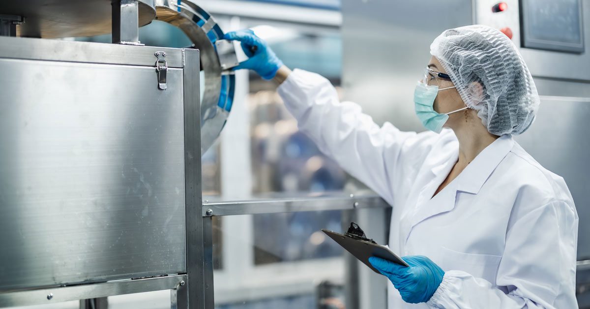 Quality control inspector testing food production machine