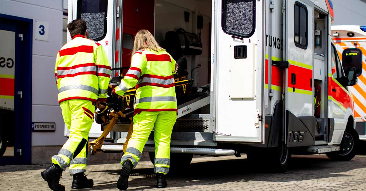 EMS workers handling a stretcher and practicing IPC training in healthcare